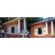 Photo of exterior painting & restoration project - before & after - pillars / fascia.